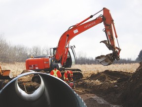 A Vulcan County crew works on a culvert bridge work northeast of Vulcan Feb. 23. By doing the work internally, the County saves a significant amount of money on such projects. Stephen Tipper Vulcan Advocate