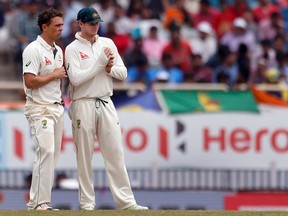 Australia's Steve Smith (right) is in a contentious test against India. (AP)
