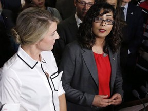 Liberal MP Iqra Khalid makes an announcement about an anti-Islamophobia motion on Parliament Hill while Minister of Canadian Heritage Melanie Joly looks on in Ottawa on Wednesday, February 15, 2017. THE CANADIAN PRESS/ Patrick Doyle