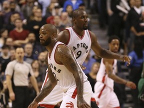 Raptors newcomers Serge Ibaka (9) and P.J. Tucker (2) in action against the Celtics during the second half of a game in Toronto on Feb. 24, 2017. (Jack Boland/Toronto Sun)