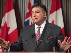 Ontario Finance Minister Charles Sousa discusses the federal budget at a news conference in Toronto on Monday, March 22, 2017. (THE CANADIAN PRESS/PHOTO)
