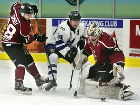 Brenden Trottier of the Nationals tries to get to a rebound off the pad of Chatham Maroons goaltender Brandon Johnston while being checked by Kevin Gursoy in the first period of their game Wednesday night at the Western Fair Sports Centre. (MIKE HENSEN, The London Free Press)