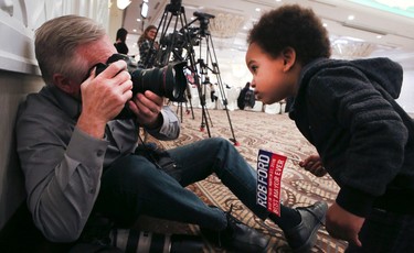 Bernard Weil, Toronto Star photographer, takes a picture of a young Rob Ford supporter as the Ford family hosts an evening to celebrate Rob Ford's memory in Etobicoke on Wednesday March 22, 2017. Veronica Henri/Toronto Sun/Postmedia Network