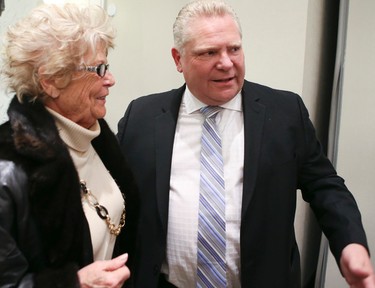 Doug Ford with his mother Diane as the Ford family hosts a evening to celebrate Rob Ford's memory in Etobicoke on Wednesday March 22, 2017. Veronica Henri/Toronto Sun/Postmedia Network