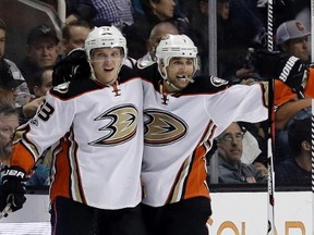 Anaheim Ducks' Jakob Silfverberg, center left, celebrates his goal with teammates Andrew Cogliano, center right, during the second period of an NHL hockey game against the San Jose Sharks Saturday, March 18, 2017, in San Jose, Calif.