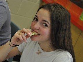 Antaya Menard digs into her celery stick in her grade 10 English class. Supplied photo
