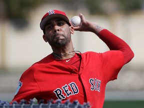 Boston Red Sox pitcher David Price throws a live batting session at a spring training baseball workout in Fort Myers, Fla. Feb. 19, 2017. (AP Photo/David Goldman)