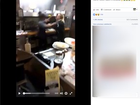 Two employees at a Waffle House are seen punching each other in front of customers. (Facebook)