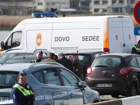 Police officers and and Sedee-Dovo, the mine clearance service of Belgian defence, patrol in Antwerp where Belgian police arrested a man on March 23, 2017 after he tried to drive into a crowd at high-speed in a shopping area in the port city of Antwerp, a police chief said. (VIRGINIE LEFOUR/AFP/Getty Images)