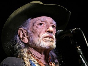 In this Jan. 7, 2017, file photo, Willie Nelson performs in Nashville, Tenn. Nelson's publicist told The Associated Press on March 22, 2017, that the singer is "perfectly fine" despite reports claiming the country music legend is "deathly ill" and struggling to breathe. (AP Photo/Mark Humphrey, File)