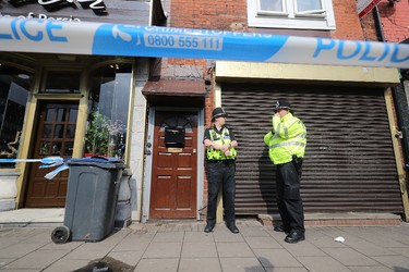 Police stand guard the entrance to a flat above Shiraz Restaurant, in Hagley Road, Birmingham, which was raided by anti-terror police in connection with the London Terror attacks on March 23, 2017 in Birmingham, England. Four people have been killed and around 40 people injured following yesterday's attack by the Houses of Parliament in Westminster.  (Photo by Christopher Furlong/Getty Images)