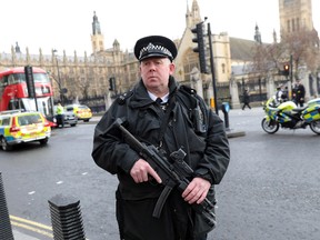 Armed officers attend to the scene outside Westminster Bridge and the Houses of Parliament on March 22, 2017 in London, England. (Jack Taylor/Getty Images)
