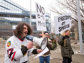 Bernard Hancock, best known as activist 'Bernard the Roughneck', speaks against the anti-Motion 103 crowd in which he's standing outside of City Hall in Calgary, Alta., on Saturday, March 4, 2017. Hancock was denouncing both sides of the M-103 debate, instead encouraging better dialogue and understanding between the two groups. Metres away, pro-M-103 demonstrators were holding a separate rally. (Lyle Aspinall/Postmedia Network)