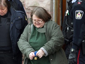 Elizabeth Wettlaufer is escorted from the courthouse in Woodstock, Ont., on Friday, Jan. 13, 2017. (THE CANADIAN PRESS/Dave Chidley)