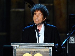 In this Feb. 6, 2015 file photo, Bob Dylan accepts the 2015 MusiCares Person of the Year award at the 2015 MusiCares Person of the Year show in Los Angeles. In a rare and lengthy interview, Dylan opened about his music and songwriting, and discussed about his relationships with Frank Sinatra, Elvis Presley and more icons. The Q&A with author Bill Flanagan was posted to Dylan’s website on Wednesday, March 22, 2017. (Photo by Vince Bucci/Invision/AP, File)