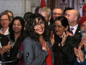 Liberal MP Iqra Khalid is welcomed by her colleagues as she arrives to make an announcement about an anti-Islamophobia motion on Parliament Hill in Ottawa on Wednesday, February 15, 2017. (THE CANADIAN PRESS/ Patrick Doyle)