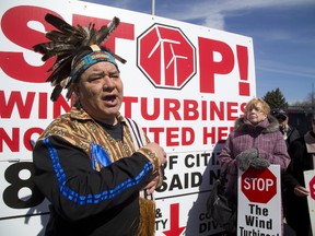 Darryl Chrisjohn of Oneida made an impassioned speech at a protest against wind turbines in Dutton Dunwich on Thursday. Chrisjohn said that only the natives from Six Nations had a right to make deals about their land, and that the fight against wind turbines should unite local communities and the reserves. (MIKE HENSEN, The London Free Press)