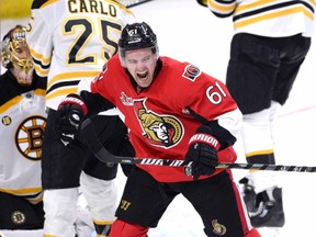 Senators' Mark Stone celebrates a goal scored by teammate Mike Hoffman (not shown) against the Bruins during third period NHL action in Ottawa on March 6, 2017. (Justin Tang/The Canadian Press)