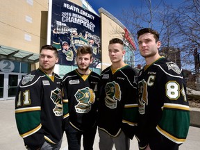 London Knights Owen MacDonald, left, Victor Mete, Tyler Parsons and captain JJ Piccinich show their game faces in front of Budweiser Gardens on Thursday with their OHL playoff opener against the Windsor Spitfires looming on Friday night. (MORRIS LAMONT, The London Free Press)