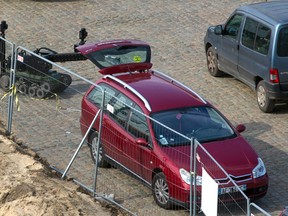 A police robot stands next to a car near the river in Antwerp, Belgium on Thursday, March 23, 2017. Belgian authorities on Thursday said they have raised security in the port of Antwerp after a car with French license plates drove at high speed through a busy shopping street, forcing pedestrians to jump out of the way. (Joris Herregods via AP)