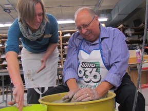 Instructor Beth Turnbull Morrish helps Sarnia-Lambton MPP Bob Bailey make a bowl during a celebrity pottery session held in February at the Lambton College pottery studio. It was in support of the Empty Bowls fundraiser set for March 31 at the Lambton College Event Centre. The annual dinner raises money for the college food bank and the Inn of the Good Shepherd.  Paul Morden/Sarnia Observer/Postmedia Network