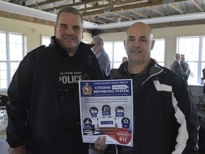 Const. Brent Milne, left, and Const. Ed Rota, right, were at the Rotary Club of Chatham March 22 to talk about Chatham-Kent's new online reporting system for minor crime. The goal is for more crimes to be reported -- especially those that might otherwise fall under the radar.