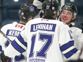 Brandon Glover of the Nationals is congratulated by linemates Quinn Lenihan and Austin Kemp after a recent goal against the Chatham Maroons. (MIKE HENSEN, The London Free Press)