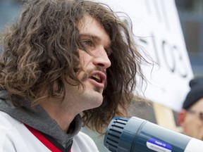 Bernard Hancock, best known as activist 'Bernard the Roughneck', speaks against the anti-Motion 103 crowd in which he's standing outside of City Hall in Calgary, Alta., on Saturday, March 4, 2017. (Lyle Aspinall/Postmedia Network)