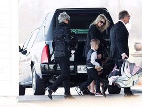 Whitney Dumas, centre, arrives with her children to Pleasantview funeral home in Thorold, Ont., Friday, March 24, 2017 for the funeral of her 7-year-old son Nathan Dumas who was killed last week. THE CANADIAN PRESS/Aaron Lynett