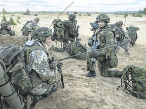 Canadian and Latvian troops take part in an exercise in September in Latvia. (Canadian Forces photo)