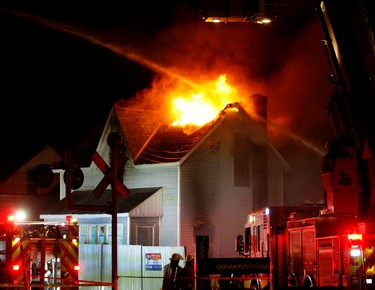 Peterborough firefighters battle a fire on Saturday March 25, 2017 in Peterborough, Ont. that gutted the former biker clubhouse on the southeast corner of Park and Perry streets in Peterborough. (Clifford Skarstedt/Peterborough Examiner/Postmedia Network)