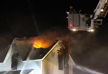 Peterborough firefighters battle a fire on Saturday March 25, 2017 in Peterborough, Ont. that gutted the former biker clubhouse on the southeast corner of Park and Perry streets in Peterborough. (Clifford Skarstedt/Peterborough Examiner/Postmedia Network)