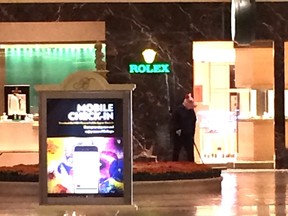 A burglary suspect in a pig mask is seen outside a Rolex Store in the Bellagio Hotel in this supplied Twitter photo.  (Twitter/@Kir_kamil/Supplied)
