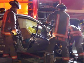 Mississauga firefighters used the jaws of life to extricate a trapped man after a two-vehicle crash at Mavis Rd. and Courtneypark Dr. on Friday, March 24, 2017. (PASCAL MARCHAND)
