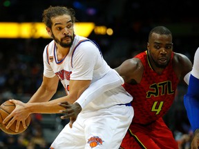 In this Jan. 29, 2017 file photo, New York Knicks centre Joakim Noah (13) looks to pass as Atlanta Hawks forward Paul Millsap (4) defends in Atlanta. (AP Photo/Todd Kirkland)