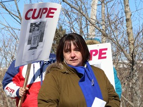 Gisele Dawson, president of CUPE Local 2841, addresses participants at a rally for laundry workers at Sudbury Hospital Services in Sudbury, Ont. on Saturday March 25, 2017. A total of 36 unionized staff at SHS will be laid off on March 31. John Lappa/Sudbury Star/Postmedia Network