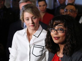Liberal MP Iqra Khalid makes an announcement about an anti-Islamophobia motion on Parliament Hill while Minister of Canadian Heritage Melanie Joly looks on in Ottawa on Wednesday, February 15, 2017. (THE CANADIAN PRESS/ Patrick Doyle)