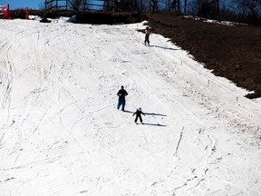 A young girl gets some assistance skiing down the slopes of Mount Joy Snow Resort, during the final day of their 2016-17 season on Sunday, March 19, 2017. Taylor Hermiston/Vermilion Standard/Postmedia Network.