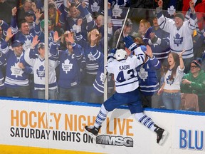 Leaf forward Nazem Kadri has this 2013 photo of himself leaping into the glass on his wall. (AP)