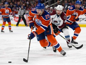 The Edmonton Oilers' Leon Draisaitl battles the Colorado Avalanche's Sven Andrighetto at Rogers Place in Edmonton on Saturday, March 25, 2017. (David Bloom)