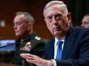 In this March 22, 2017 file photo, Defence Secretary Jim Mattis, joined by Joint Chiefs Chairman Gen. Joseph Dunford, left, testifies on Capitol Hill in Washington.  (AP Photo/Manuel Balce Ceneta, File)