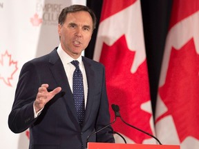 Finance Minister Bill Morneau addresses The Canadian Club of Toronto and The Empire Club regarding Budget 2017 in Toronto on Friday March 24, 2017. THE CANADIAN PRESS/Frank Gunn