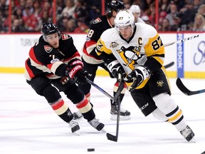 Ottawa Senators' Kyle Turris chases Pittsburgh Penguins' Sidney Crosby during first period NHL hockey action in Ottawa, Thursday March 23, 2017. THE CANADIAN PRESS/Justin Tang