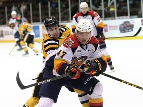Erie Otters' Owen Headrick (47) and Sarnia Sting's Jordan Kyrou battle in the first period during Game 2 in their OHL Western Conference quarter-final at Progressive Auto Sales Arena in Sarnia, Ont., on Saturday.
Mark Malone/Chatham Daily News/Postmedia Network