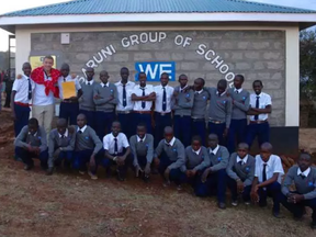 Ottawa's Mitch Kurylowicz, 19, poses with the first class of students at Ngulot Secondary School in Kenya. -