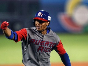 Puerto Rico’s Francisco Lindor celebrates after a home run during a World Baseball Classic game against Mexico in Guadalajara, Saturday, March 11, 2017. (AP Photo/Luis Gutierrez)