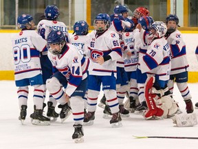 Members of the Kingston Canadians celebrate after winning the Lakeshore Hockey League Minor Peewee A final on Saturday at Centre 70. The Canadians won the six-point final, 6-2, over the Whitby Wildcats Blue, Jack Leonard scored in overtime to give Kingston a 3-2 victory Saturday. (Tim Gordanier/The Whig-Standard)