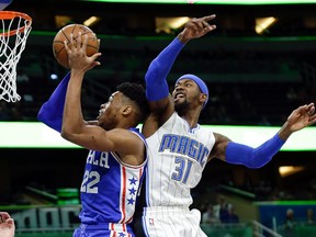 Orlando Magic’s Terrence Ross (31) tries to stop Philadelphia 76ers’ Richaun Holmes (22) from going to the basket Monday, March 20, 2017, in Orlando, Fla. (AP Photo/John Raoux)