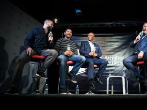 Mike Reilly (left), Anthony Calvillo, Warren Moon and TSN’s Rod Smith share a laugh during a panel of CFL quarterbacks during CFL Week on Thursday (Johany Jutras photo)