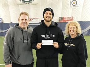 CIS All-Canadian, Derek Wendel, is flanked by Peter Gabriel and Brenda Gabriel of the No Limits Youth Organization following a recent football clinic at the Loyalist College Sports Dome. (Submitted photo)